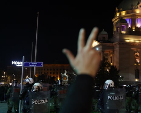 A man shouts slogans at pro-government supporters as riot police officers divide pro-government supporters and supporters of Dijana Hrka, mother of Stefan Hrka, one of the victims of the Novi Sad train station accident, as she begins her hunger strike in Belgrade, Serbia.