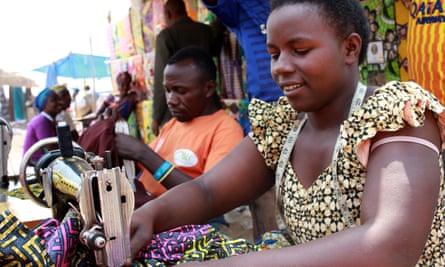 Two tailors from Rwanda and Burundi work at Kityaza market in Nakivale refugee camp.