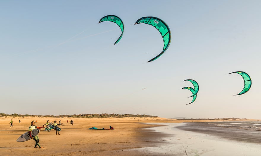 kitesurfers on beach in Morocco