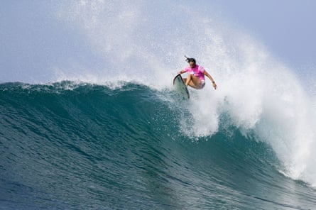 Beachley surfs a large wave