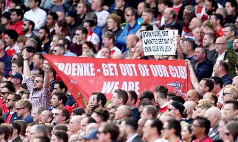 Arsenal fans hold up anti-Stan Kroenke banners during the match against Everton at the Emirates on Sunday.