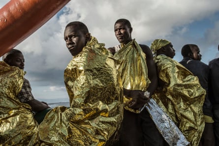 After spending two days and two nights on the MSF Bourbon Argos, rescued migrants catch sight of the Italian coast for the first time. 23 August 2015