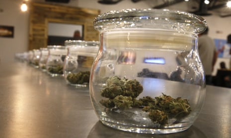 Marijuana for sale is kept in jars for customers to sample smells on opening day of a new outlet in Aurora, Colorado.