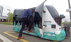 A passenger hops into Harry, the driverless pod being trialled in Greenwich, south-east London