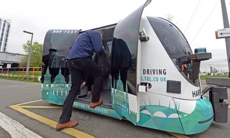 A passenger hops into Harry, the driverless pod being trialled in Greenwich, south-east London