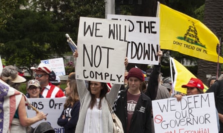 Protesters rally at the Capitol building in Sacramento on 20 April to demand that Governor Gavin Newsom ease coronavirus restrictions.