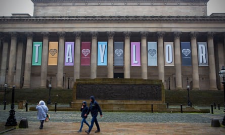 St George’s Hall in Liverpool, with – between its pillars – banners saying “Liverpool loves” alternating with banners spelling out the letters of “Taylor”