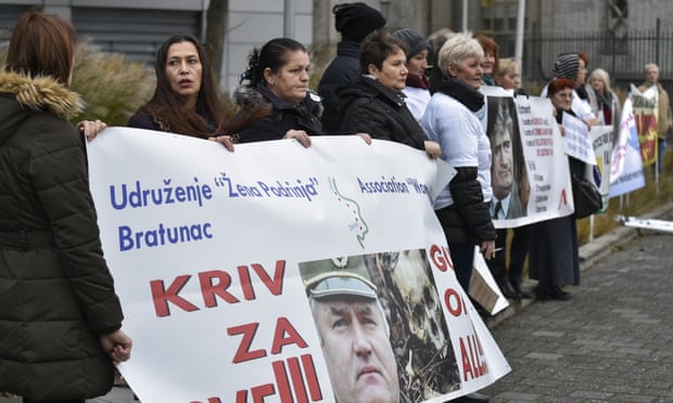 People, including victims, protest in front of the international criminal tribunal for the former Yugoslavia (ICTY) prior to the verdict