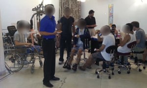 Patients recover after undergoing limb lengthening surgery.