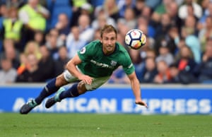 Craig Dawson dives to clear the ball away for West Bromwich Albion against Brighton at The Amex Stadium.