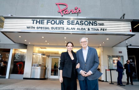 Alda with Tina Fey outside a cinema with a sign reading The Four Seasons