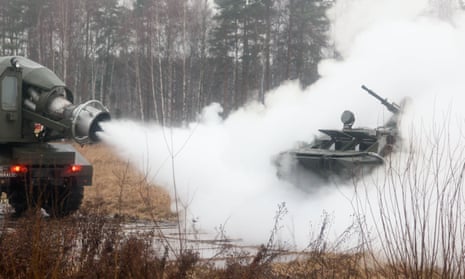 A Russian armoured personnel carrier is decontaminated during a simulated accident involving hazardous substances.