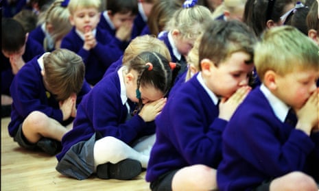 Children praying in assembly