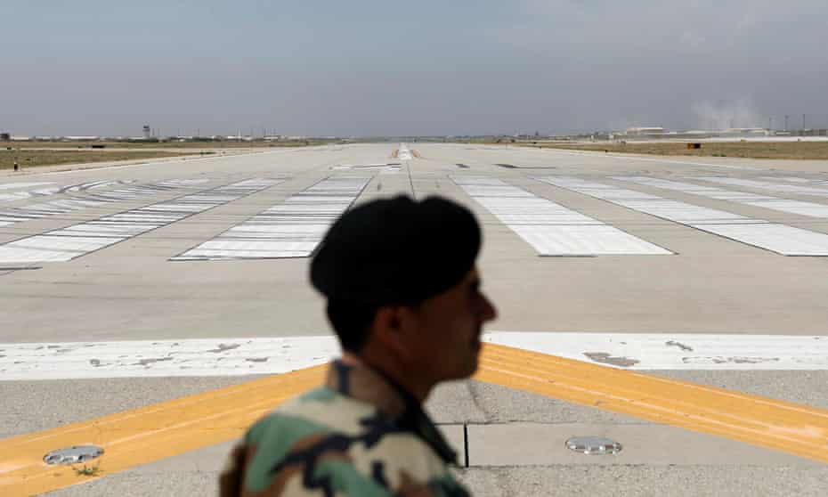 An Afghan soldier by the runway at the huge Bagram airbase following the departure of US troops.