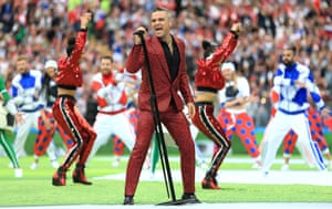 Robbie Williams takes to the pitch to belt out his famous hit “Let me entertain you” which Fifa will hope this tournament will do