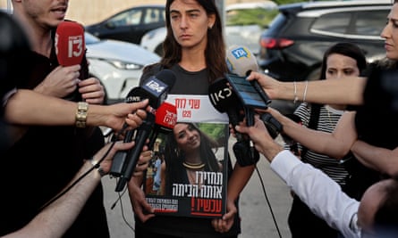 The cousin of Shani Nicole Louk, 22, with her photograph.