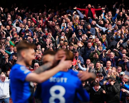 Bournemouth fans and players celebrate after Alex Scott scored their second goal at the Emirates Stadium.