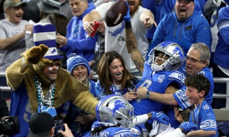 Detroit Lions wide receiver Josh Reynolds celebrates with fans after scoring the first touchdown of the game