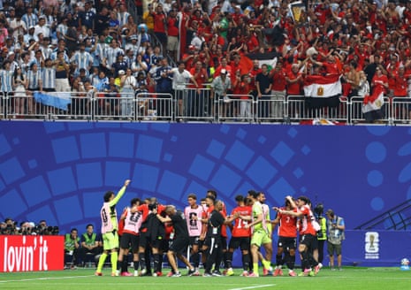 Egypt’s Mostafa Zico celebrates scoring their second goal with teammates.
