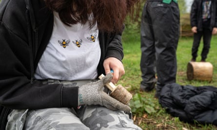 A girl wittling a mushroom as part of the Rejuvenate Project