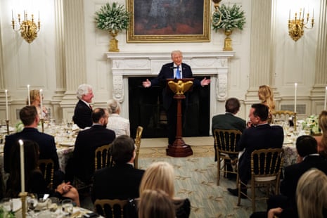 US President Donald Trump (C) speaks, during a Kennedy Center Board dinner at the White House in Washington DC, on Monday.