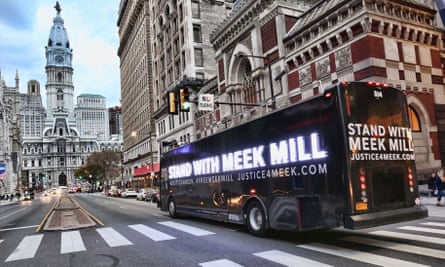 Hundreds of people have rallied in support of Meek Mill at Philadelphia’s City Hall, seen in the background.