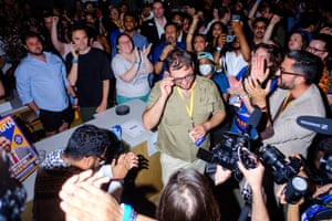 People cheer for a man