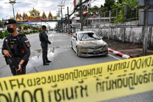 Narathiwat, Thailand. Officers stand guard after a car bomb exploded outside police accommodation. One person died and more than two dozen were injured in the attack, the provincial governor said