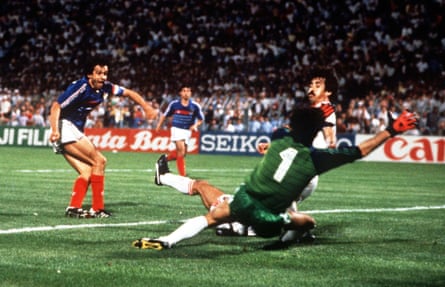 Michel Platini, the star of Euro 84, scores the most dramatic of late winners for hosts France in the semi-final against Portugal.