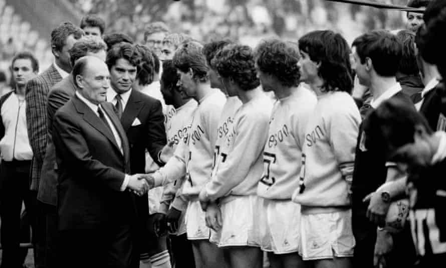 Bernard Tapie with president François Mitterrand shaking hands with the players in April 1986 at the French Cup final match between Bordeaux and Marseille at the Parc des Princes stadium in Paris