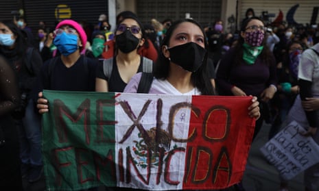 Feminist activists who have taken over the human rights commission building demonstrate in Mexico City, Mexico, on 14 September. 