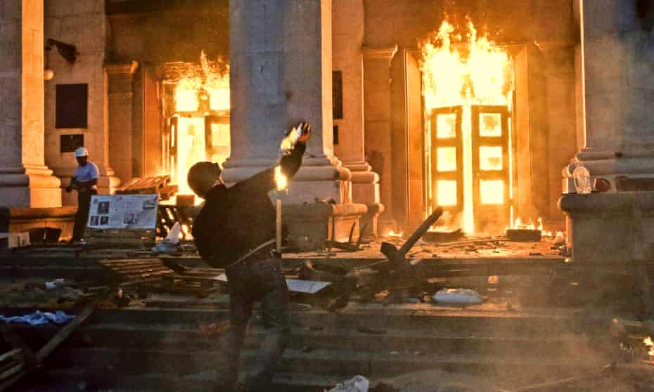 A petrol bomb is hurled at the burning trade union building in Odessa, Ukraine, in 2014.