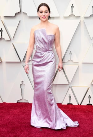 Game of Thrones star Emilia Clarke revealed she'd swapped her blonde lob for a brunette bob, teamed with a long lilac gown. Look closely and you can spot the GoT tribute tattoo on her right wrist