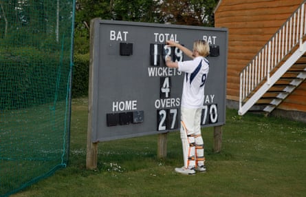 A batsman for Hambledon’s third XI changes the scoreboard while waiting to bat against Portsmouth third XI at Broadhalfpenny Down.