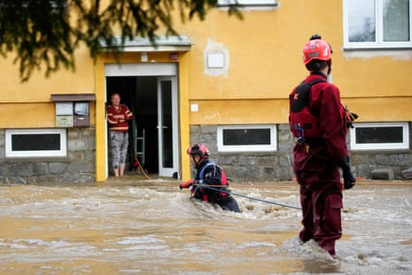 A resident waits to be evacuated from his flooded house in Jesenik, Czech Republic, Sunday, Sept. 15, 2024.