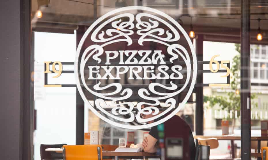 A customer dining at a branch of Pizza Express in London