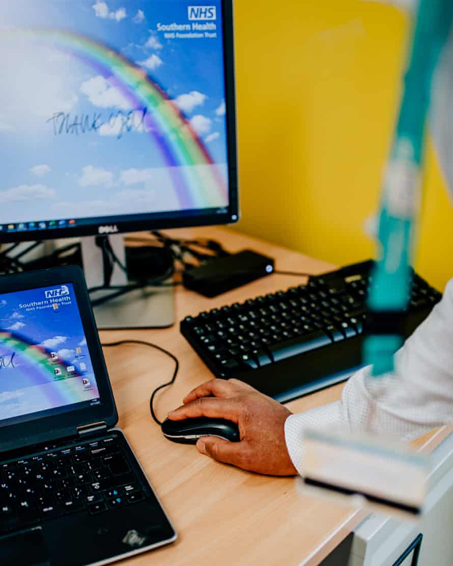 Dr Peter Phiri using an NHS laptop
