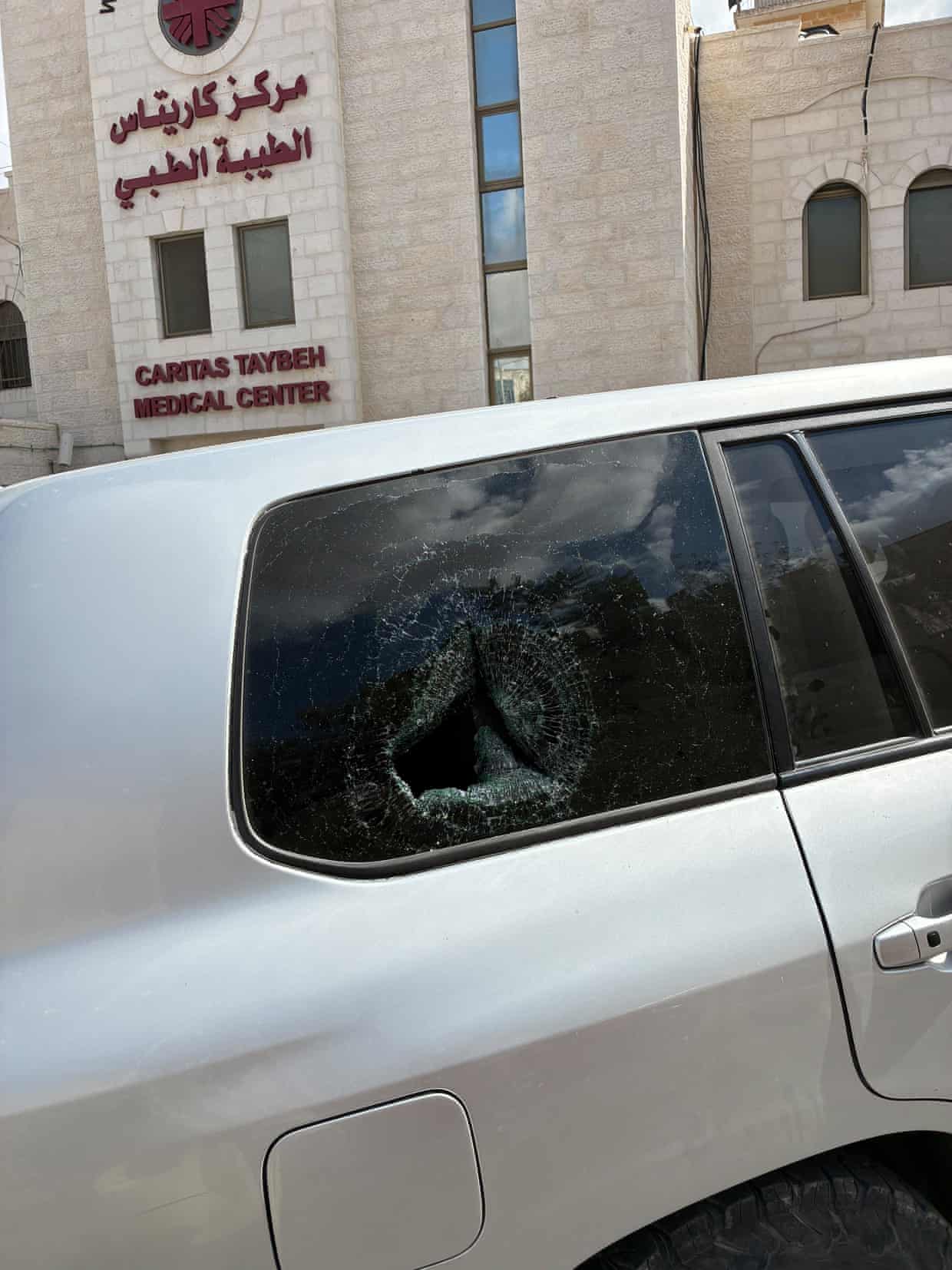 A smashed rear passenger window