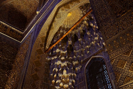 A highly decorated tiled interior in dark blue and gold
