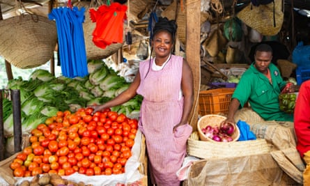 Nice Wambui at her produce stand in City Park market. With too much in stock and not enough buyers, her primary concern right now is business rather than coronavirus