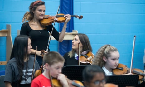 ‘Music fires the imagination in young minds’: Nicola Benedetti works with primary school children in Raploch, Stirling, home to the first ‘Big Noise Orchestra’.