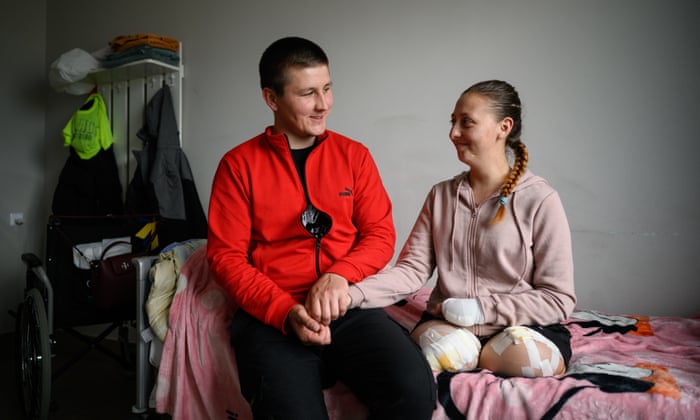 Oksana Balandina and her husband Viktor Vasyliv in her hospital room in Lviv, Ukraine.