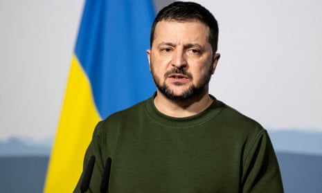 File photo of Volodymyr Zelenskiy in front of Ukraine's flag