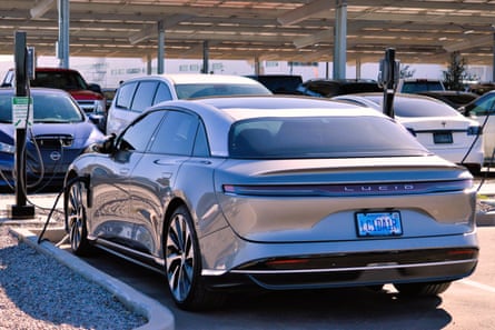 Lucid car surrounded by other cars in a car park