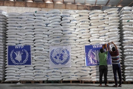 Workers unload bags of aid from the UN World Food Programme (WFP) at a warehouse near the Syrian Bab al-Hawa border crossing with Turkey, on 10 July 2023. The UN World Food Programme (WFP) ended its main assistance program in Syria in January 2024.