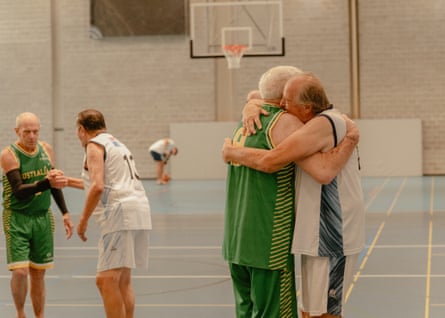 Players from Australia’s Men’s Over 80 basketball team congratulate their Argentina counterparts after a game as the nation’s most senior representative.