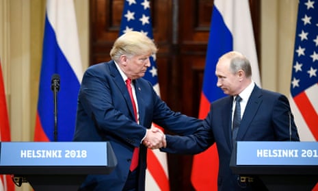 Donald Trump and Vladimir Putin shake hands in Helsinki