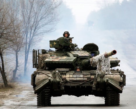 Ukrainian tanks move towards the front line in the Lugansk region on 25 February last year.