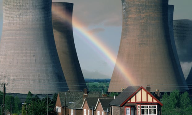 Houses in Rugeley with power-station cooling towers in the background and a rainbow