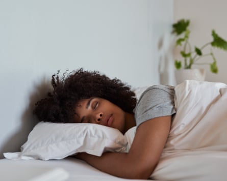 Young woman sleeping in her bed in the morning